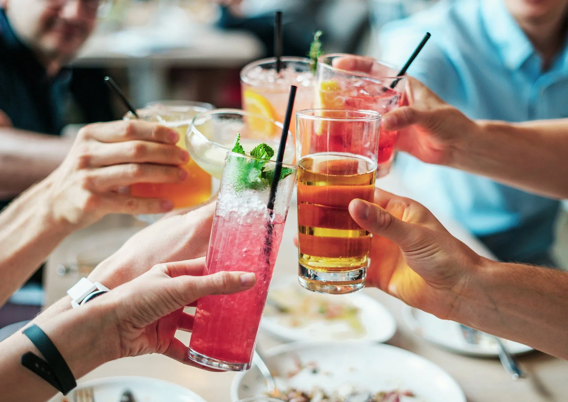 Several glasses of cocktails lying around the aperitif